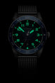 Victorinox watch with green glowing face on a black background