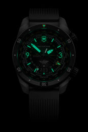 Black watch with green glowing face on a black background