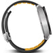 Close-up of a smartwatch band with black and yellow design on a white background