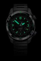 Black watch with green glowing face on a black background