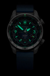 Victorinox watch with glowing green face on a black background