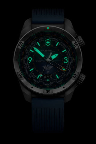 Victorinox watch with glowing green face on a black background
