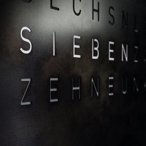 QLOCKTWO Earth 90 Creators Edition Raw Iron Wall Clock